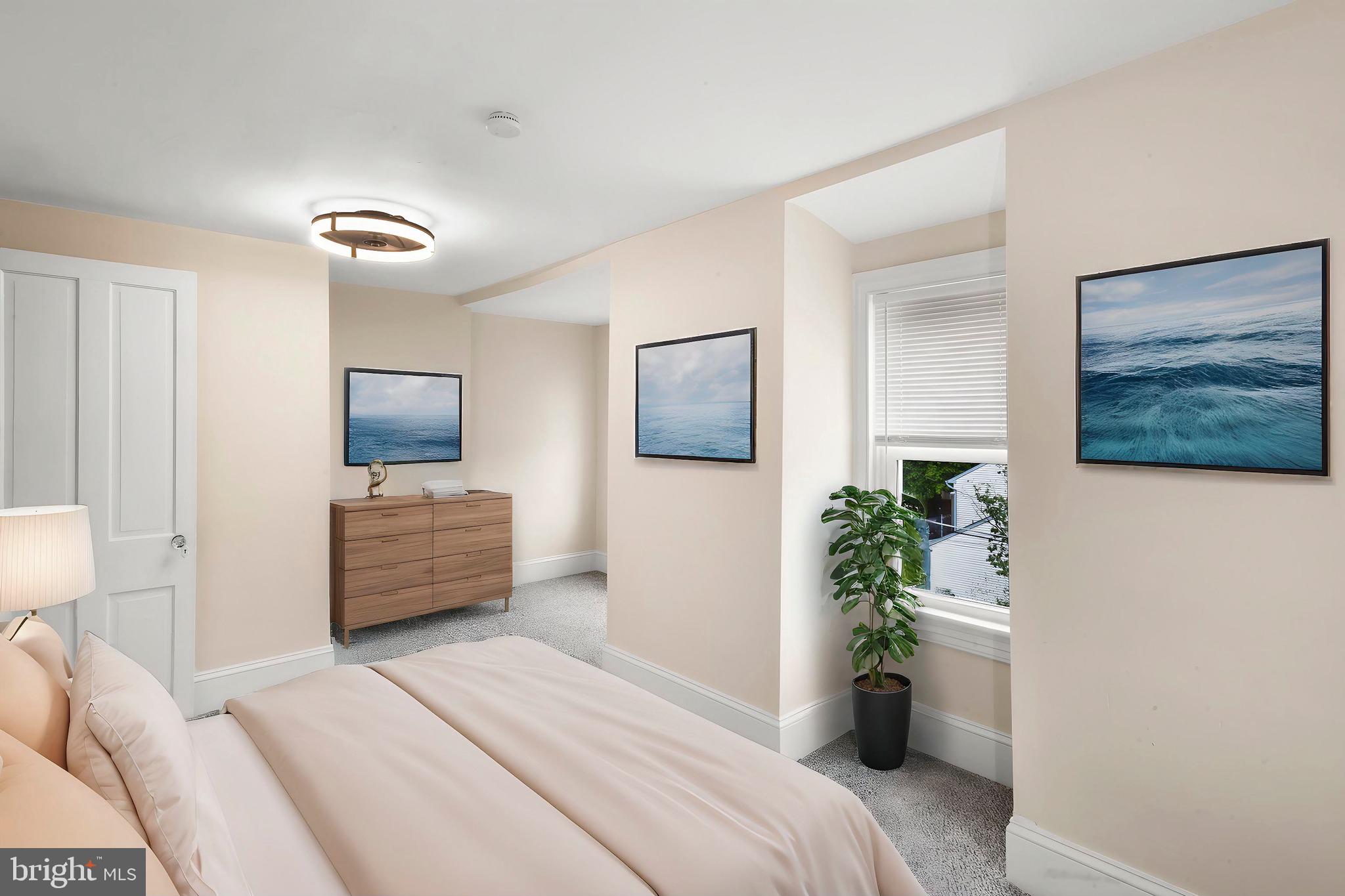 74 Pitman Avenue, Unit B Pitman, NJ 08071 - Photo 10 of 30 a bedroom with a bed potted plant and a window