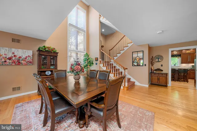 a kitchen with stainless steel appliances granite countertop a sink refrigerator and cabinets