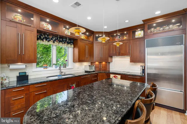 a bedroom with a large bed and a large window