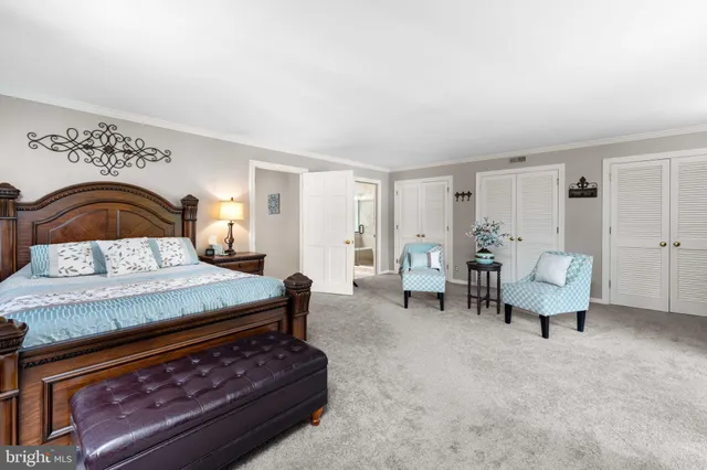 a view of a workspace with furniture and a potted plant