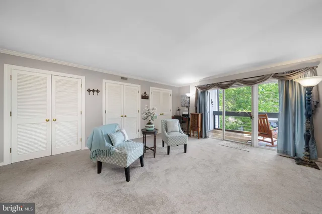 a bedroom with a bed and a chair