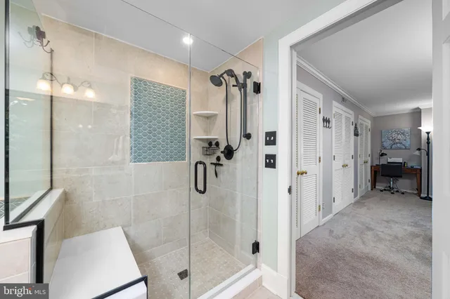 a bathroom with a toilet and a bathtub