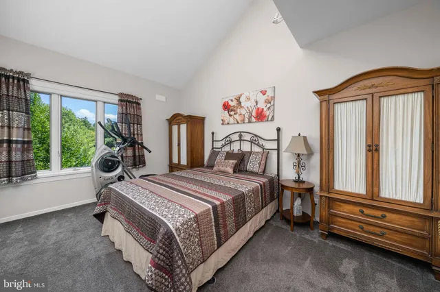 a view of a garden with a building in the background