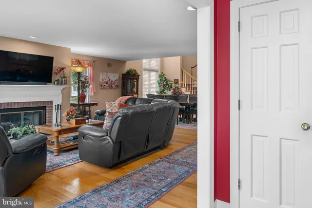 a living room with furniture and a rug