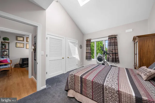 a backyard of a house with a yard and outdoor seating