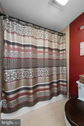 a view of a park with trees in the background