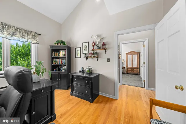 an aerial view of multiple houses and a yard