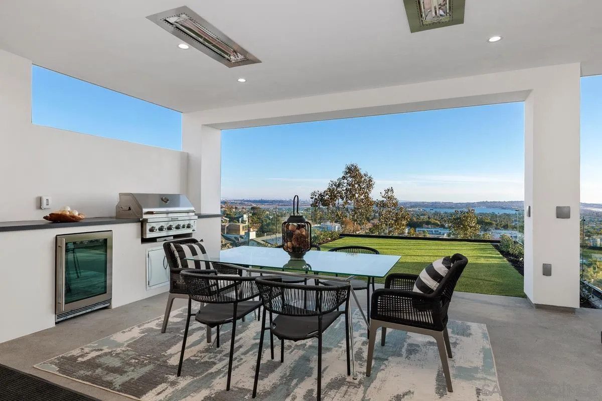 1237 Van Nuys Street San Diego, CA 92109 - Photo 11 of 32 a view of a dining table and chairs in the kitchen