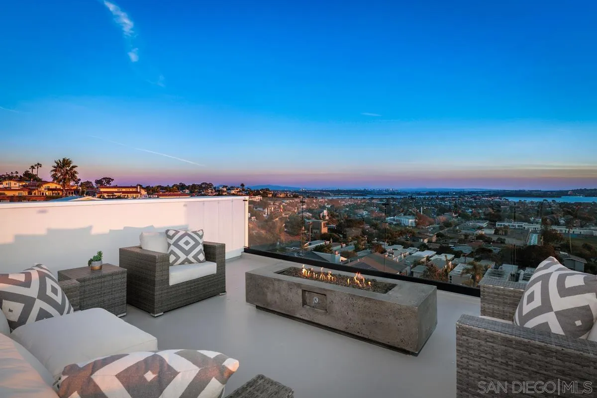 1237 Van Nuys Street San Diego, CA 92109 - Photo 2 of 32 a view of a terrace with couches and lounge chairs