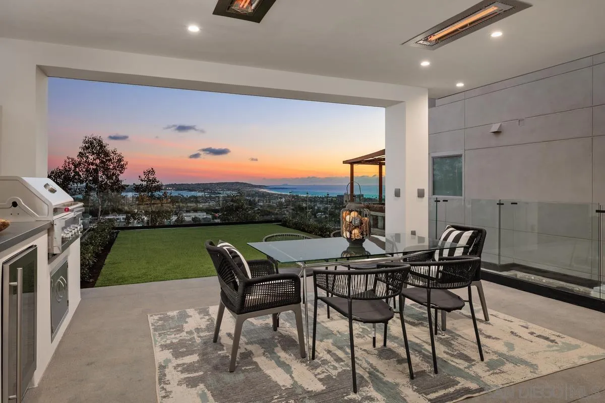 1237 Van Nuys Street San Diego, CA 92109 - Photo 25 of 32 a dining room with furniture and a floor to ceiling window