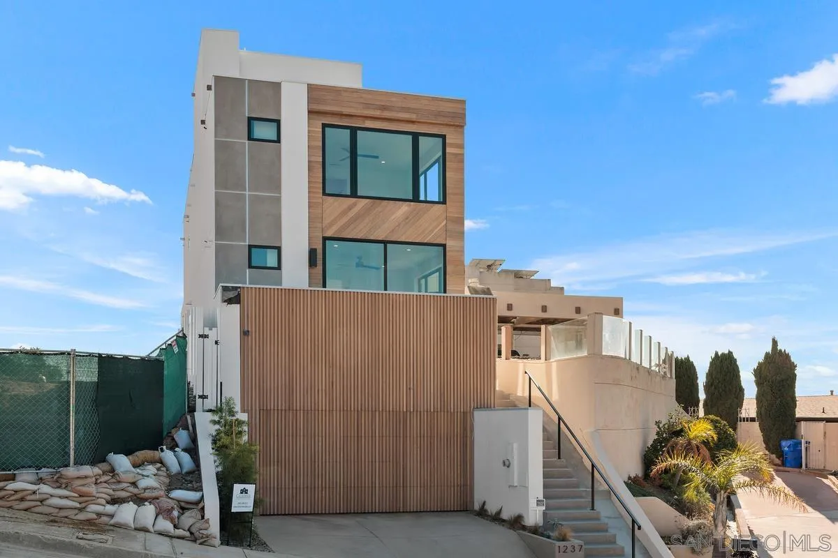 1237 Van Nuys Street San Diego, CA 92109 - Photo 27 of 32 a view of a house with a backyard