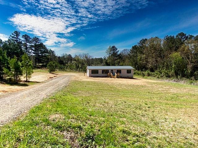 2509 Pinckney Road Chester, SC 29706 - Photo 1 of 19 a swimming pool with outdoor seating and yard