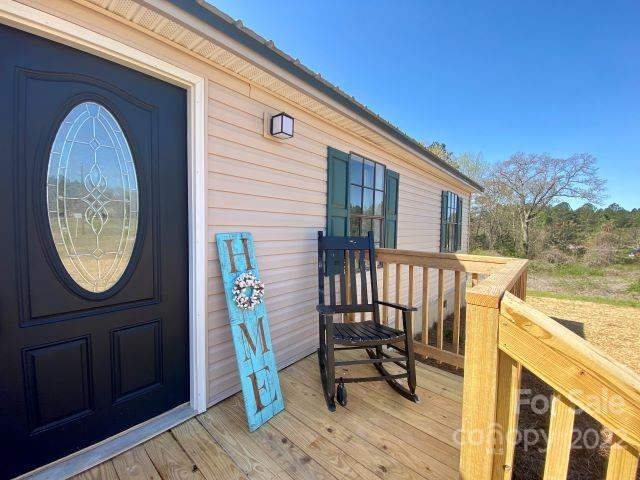 2509 Pinckney Road Chester, SC 29706 - Photo 4 of 19 a view of a wooden bench with a porch