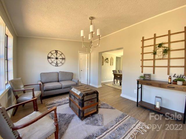 2509 Pinckney Road Chester, SC 29706 - Photo 5 of 19 a living room with furniture and a chandelier