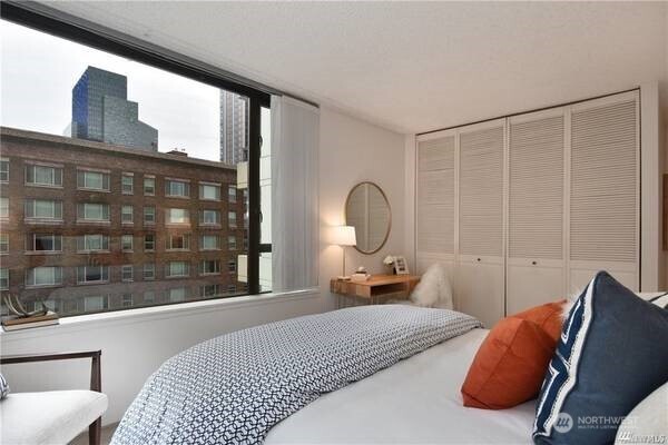 2201 3rd Avenue, Unit 804 Seattle, WA 98121 - Photo 13 of 22 a bedroom with bed and window