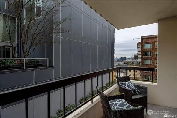 a view of a balcony with furniture