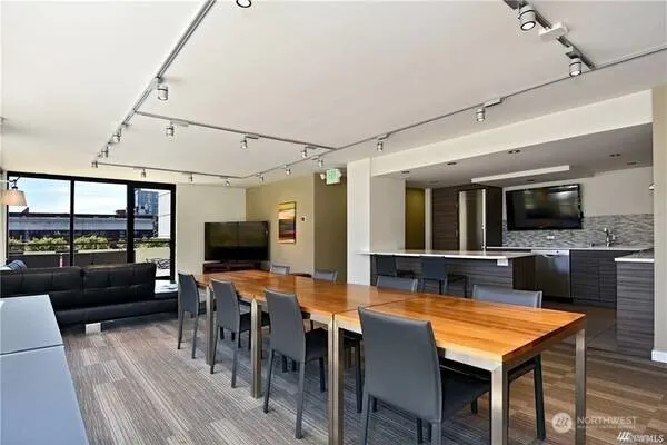 a view of a dining room with furniture and wooden floor