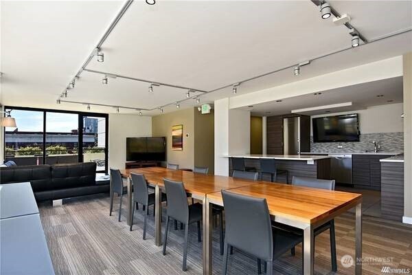 2201 3rd Avenue, Unit 804 Seattle, WA 98121 - Photo 20 of 22 a view of a dining room with furniture and wooden floor