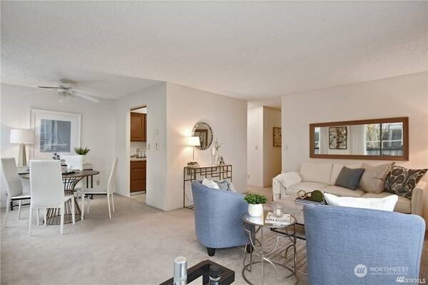2201 3rd Avenue, Unit 804 Seattle, WA 98121 - Photo 5 of 22 a living room with furniture and wooden floor