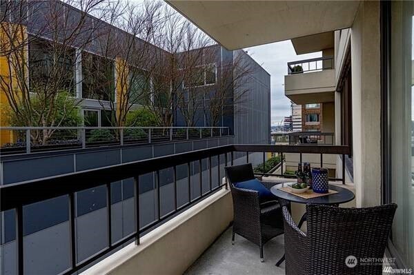 2201 3rd Avenue, Unit 804 Seattle, WA 98121 - Photo 6 of 22 a view of a chairs and table in the balcony