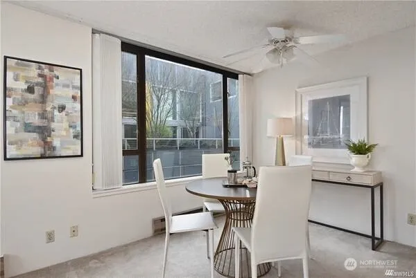 a dining room with furniture and window