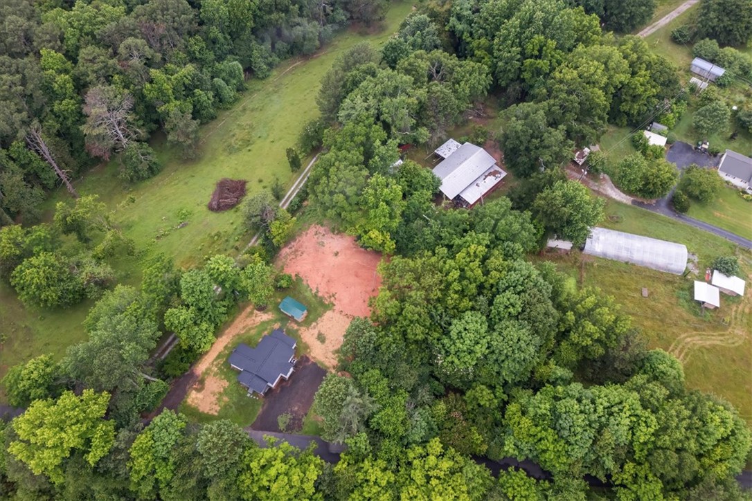 174 Holliday Road Six Mile, SC 29682 - Photo 47 of 49 An aerial perspective reveals the expansive, wooded property with space to add additional storage or garage structures