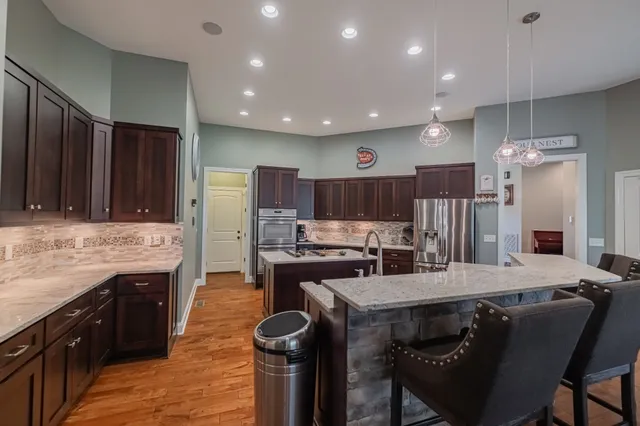 a kitchen with a stove a refrigerator and a stove
