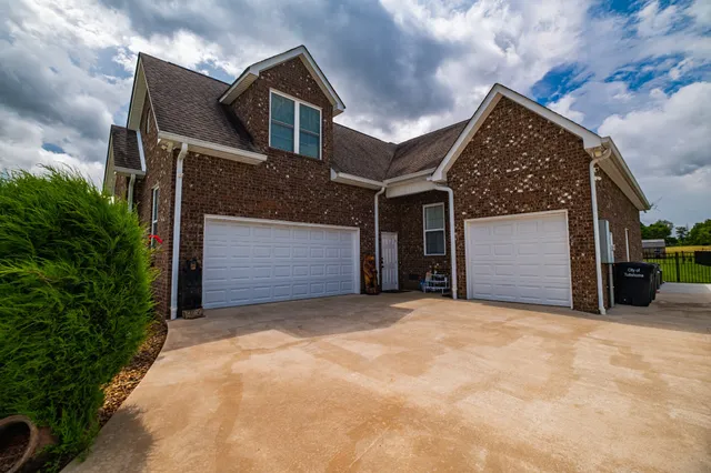 a front view of a house with a garage