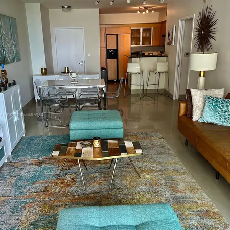 a kitchen with stainless steel appliances granite countertop a sink and a microwave