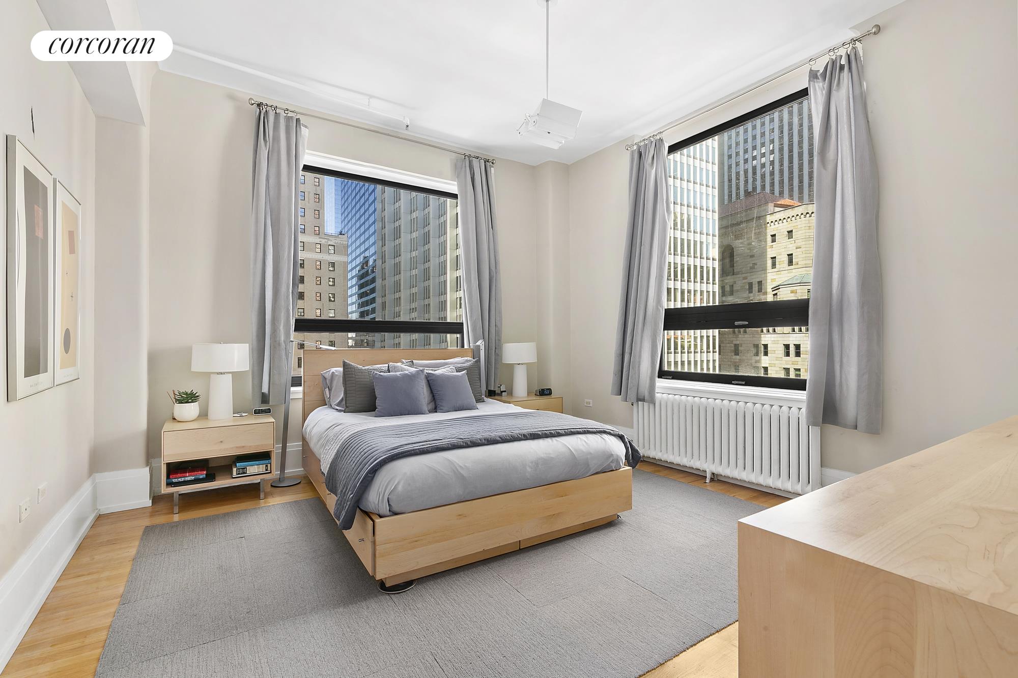 50 Pine Street, Unit PH12N Manhattan, NY 10005 - Photo 3 of 10 a spacious bedroom with a bed and a window