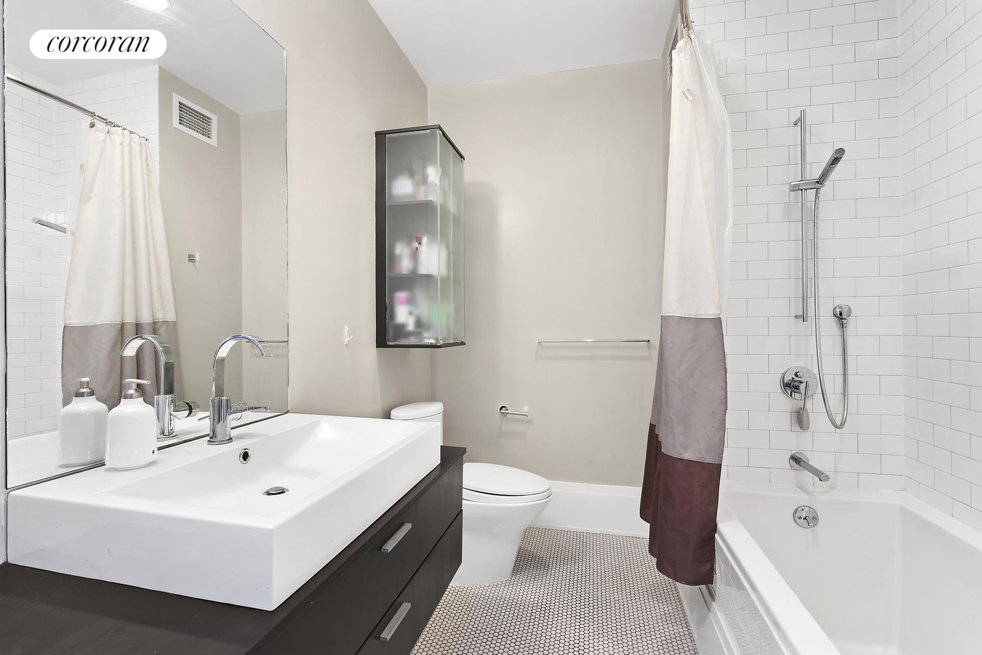 50 Pine Street, Unit PH12N Manhattan, NY 10005 - Photo 6 of 10 a bathroom with a sink a toilet and shower