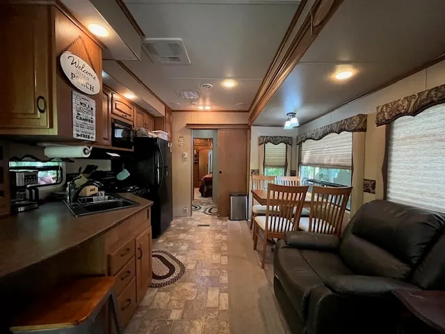 a living room with furniture and a lamp