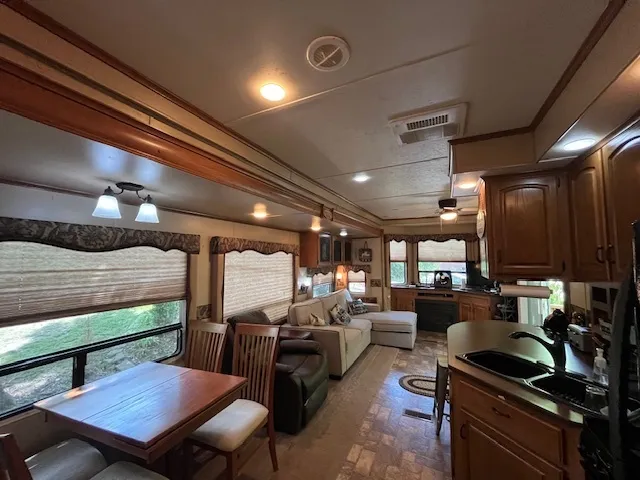 a kitchen with a sink appliances and cabinets