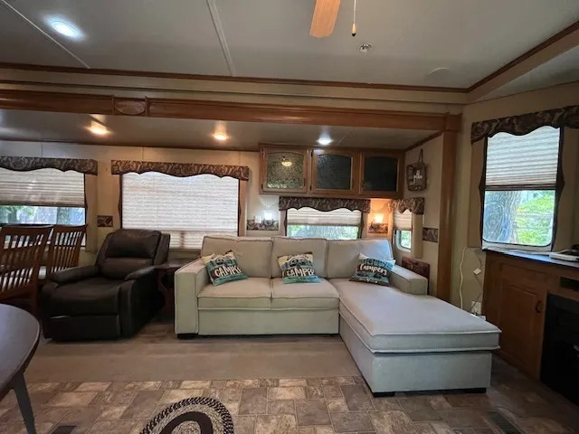 a kitchen with stainless steel appliances kitchen island granite countertop a refrigerator a stove a sink and dishwasher with a dining table