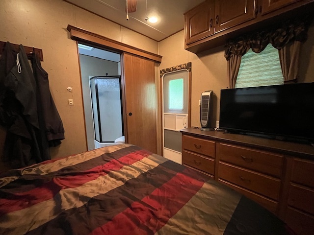 2795 East 28th Road Marseilles, IL 61341 - Photo 23 of 73 a bedroom with a bed and a flat screen tv