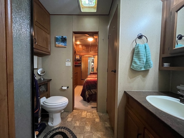 2795 East 28th Road Marseilles, IL 61341 - Photo 24 of 73 a bathroom with a toilet a sink and mirror