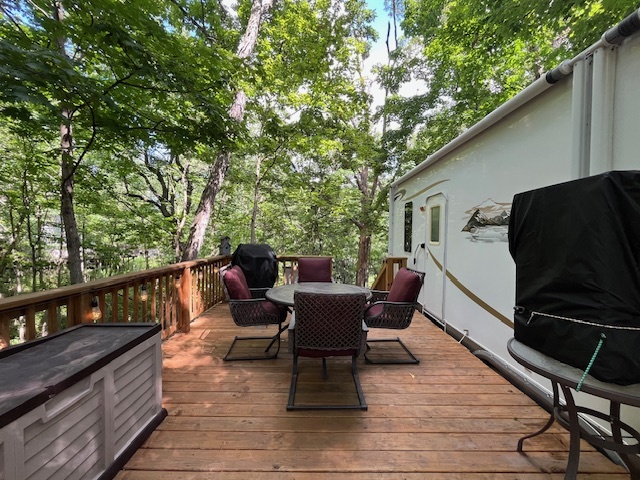 2795 East 28th Road Marseilles, IL 61341 - Photo 27 of 73 a roof deck with table and chairs and wooden floor