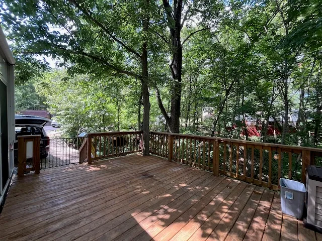 a view of a house with a yard and balcony