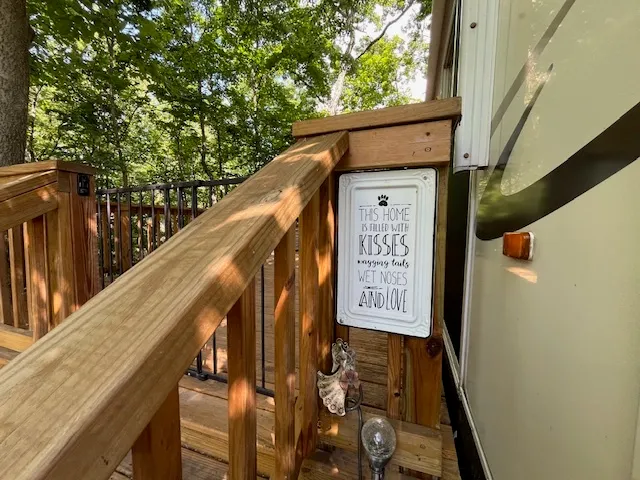 a view of a big house with a big yard and large trees