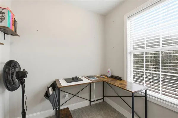 a room with a desk and a workspace