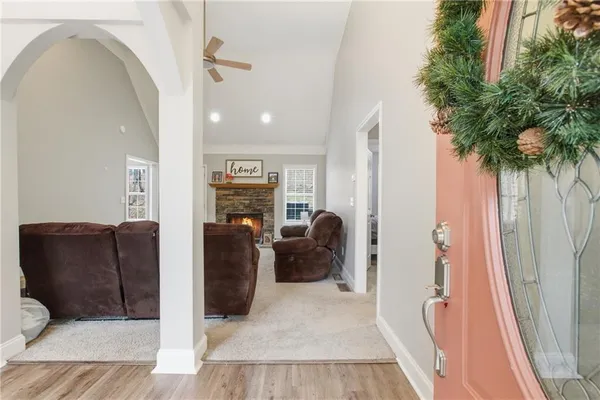 a living room with furniture a couch and a potted plant