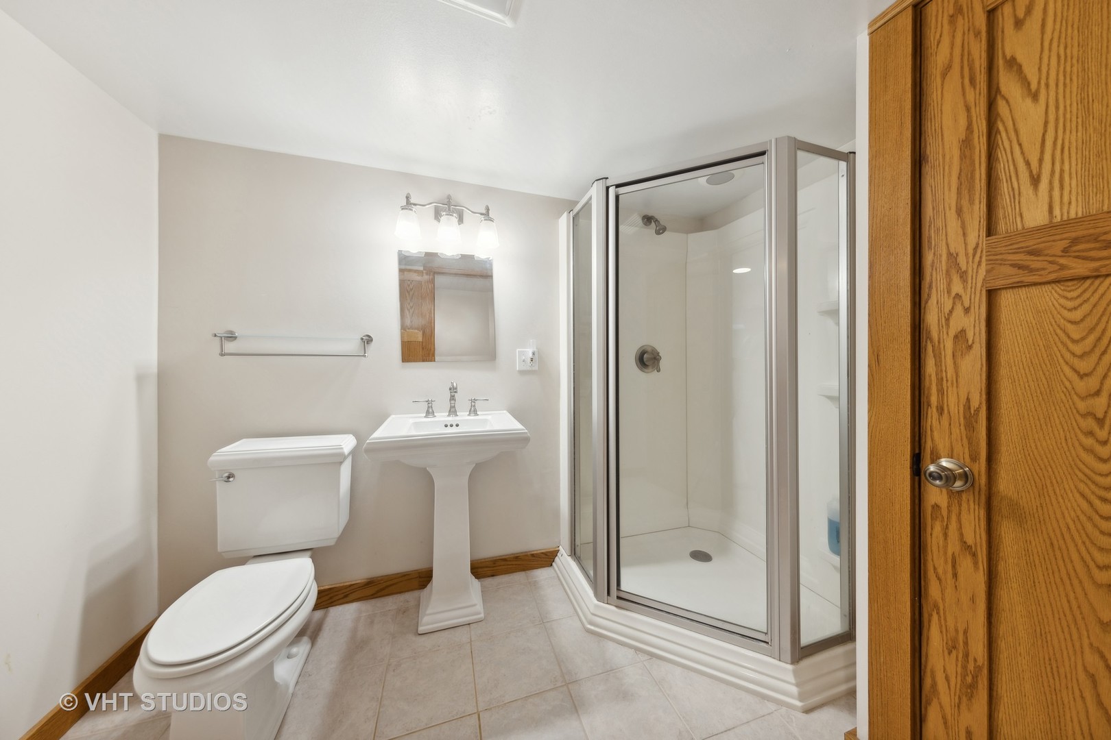 155 Geneva Avenue Elmhurst, IL 60126 - Photo 23 of 33 a bathroom with a toilet a sink and shower