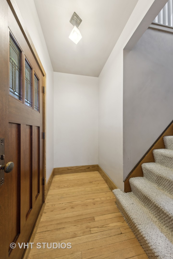 155 Geneva Avenue Elmhurst, IL 60126 - Photo 4 of 33 a view of a hallway with a white door