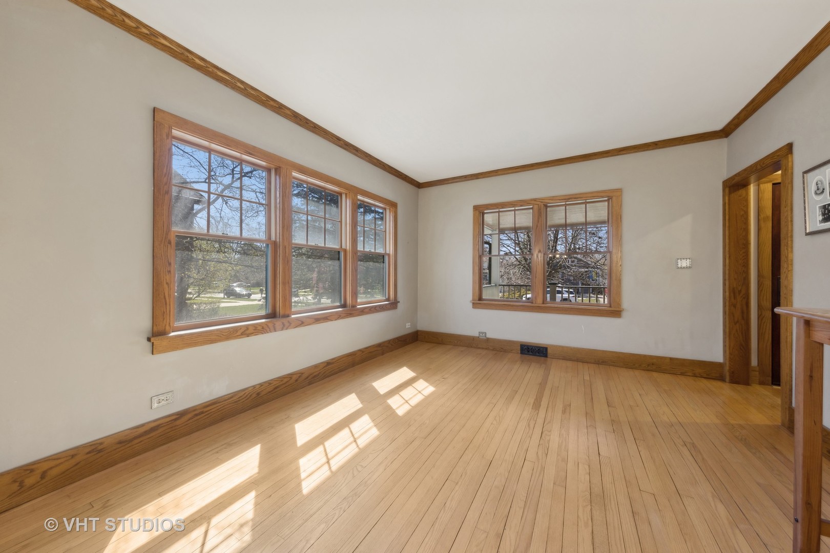 155 Geneva Avenue Elmhurst, IL 60126 - Photo 8 of 33 a view of an empty room with window and wooden floor