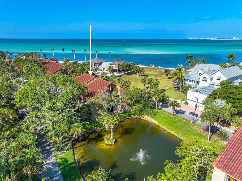 a view of a golf course with an ocean