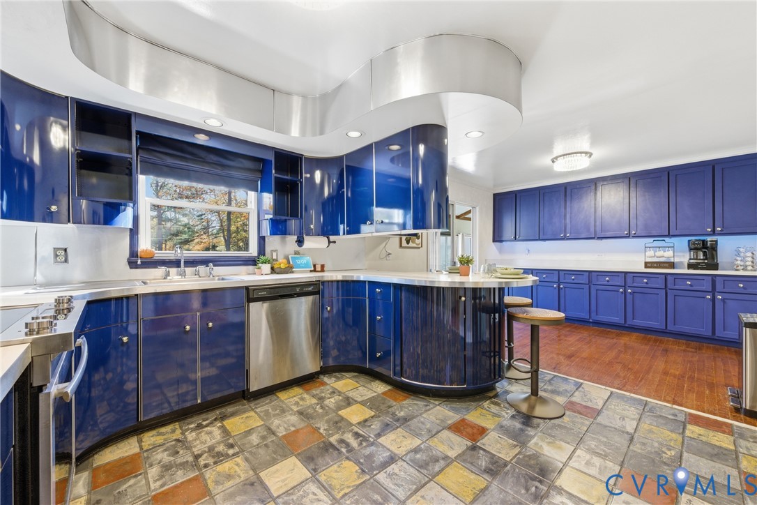 7471 Shoreline Drive Quinton, VA 23141 - Photo 12 of 45 a kitchen with stainless steel appliances granite countertop wooden cabinets a stove a sink and a oven