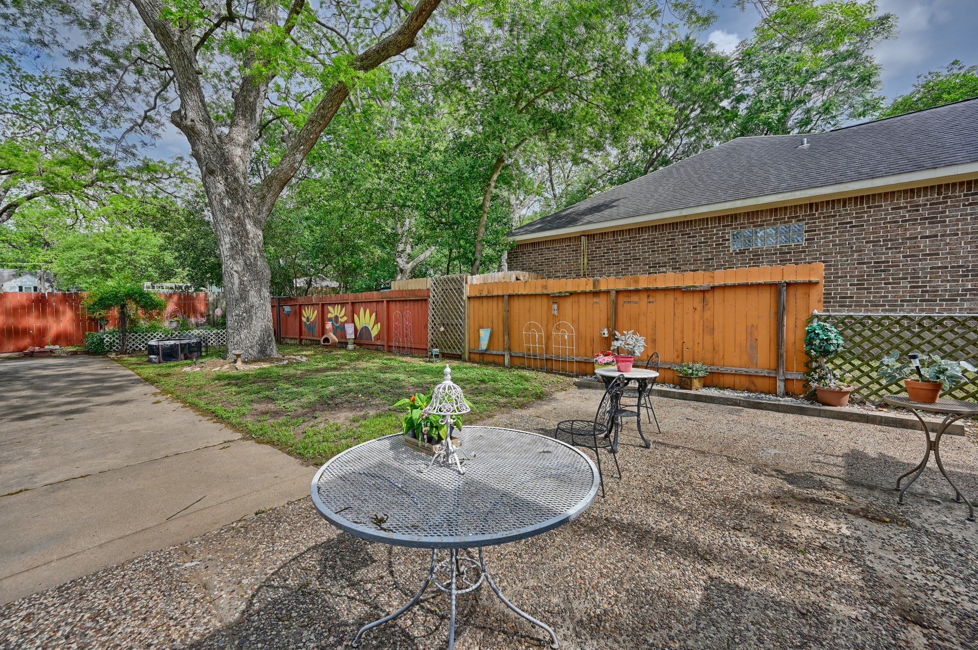 1501 South Austin Street Brenham, TX 77833 - Photo 28 of 36 a backyard of a house with table and chairs