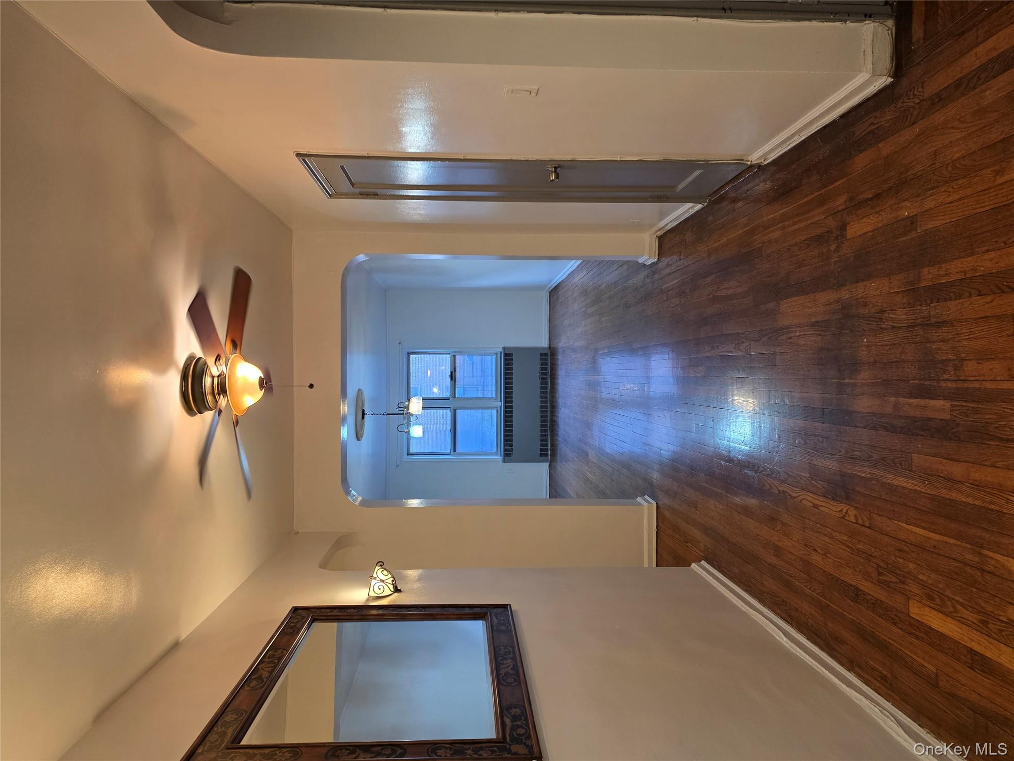 65-70 Booth Street, Unit 2B Queens, NY 11374 - Photo 3 of 8 a view of empty room with wooden floor