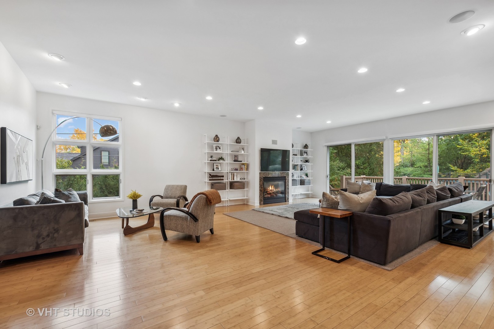 Undisclosed Address Highland Park, IL 60035 - Photo 11 of 32 a living room with furniture floor to ceiling window and a flat screen tv