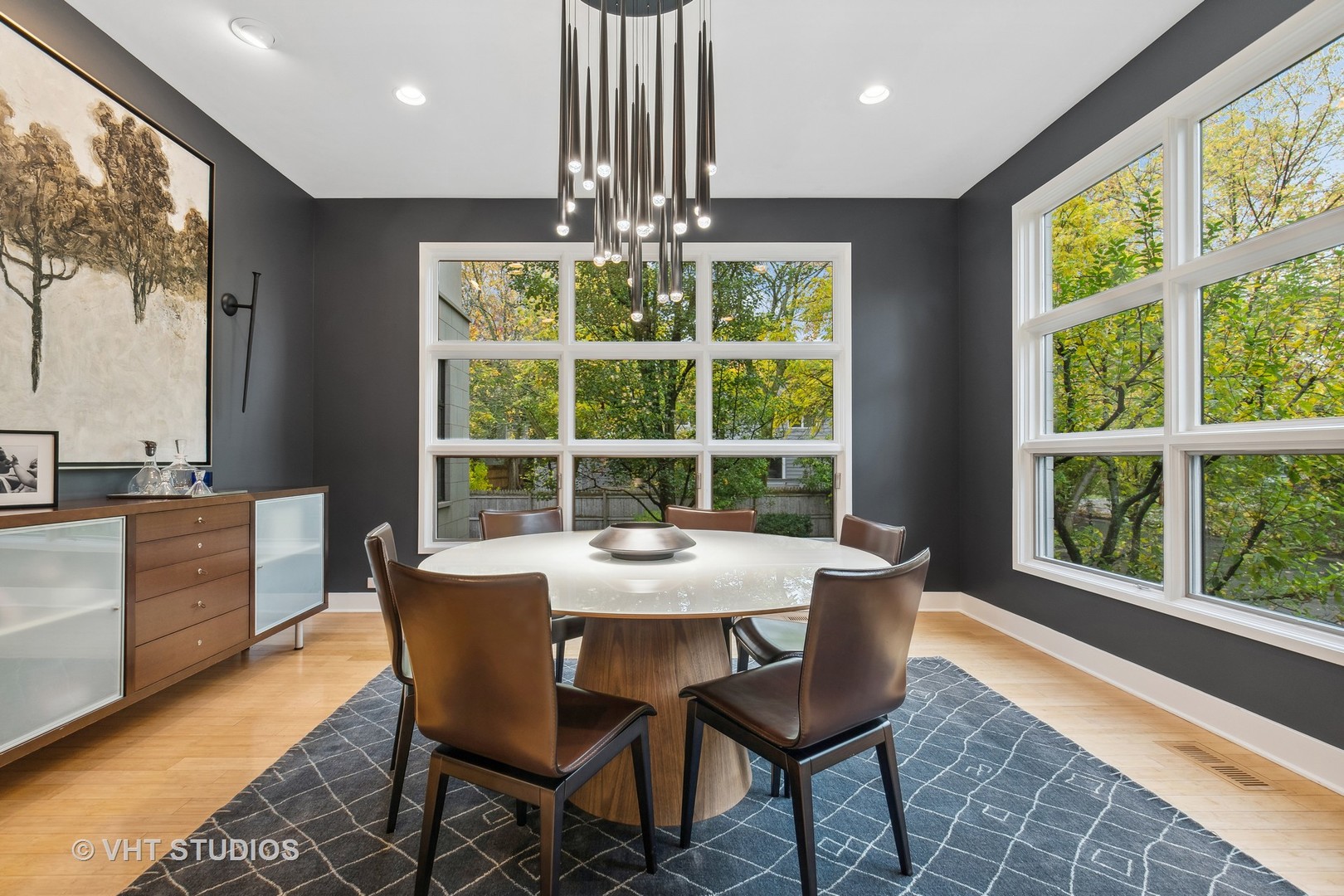 Undisclosed Address Highland Park, IL 60035 - Photo 12 of 32 a dining room with furniture a rug and a floor to ceiling window